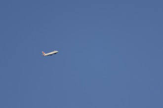 Airbus A320-232 jet passenger aircraft of British Airways airlines in flight in a blue sky, London,