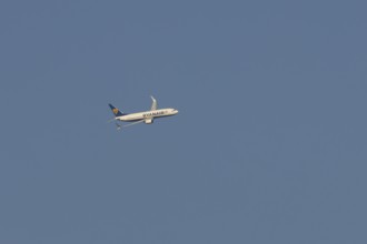 Boeing 737 jet passenger aircraft of Ryanair airlines in flight in a blue sky, Rome, Italy