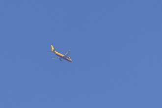 Boeing 767 jet aircraft of DHL cargo airlines in flight in a blue sky, England, United Kingdom
