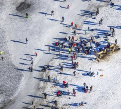 Aerial view, ice rink, ice skaters and pedestrians on frozen Rhine meadow in Lörrick near the