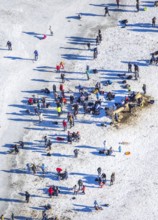 Aerial view, ice rink, ice skaters and pedestrians on frozen Rhine meadow in Lörrick near the