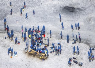 Aerial view, ice rink, ice skaters and pedestrians on frozen Rhine meadow in Lörrick near the