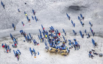 Aerial view, ice rink, ice skaters and pedestrians on frozen Rhine meadow in Lörrick near the