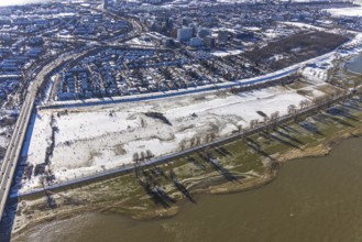 Aerial view, ice rink, ice skaters and pedestrians on frozen Rhine meadow in Lörrick near the