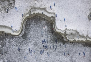 Aerial view, ice rink, ice skaters and pedestrians on frozen Rhine meadow in Lörrick near the