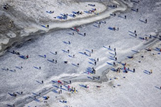 Aerial view, ice rink, ice skaters and pedestrians on frozen Rhine meadow in Lörrick near the