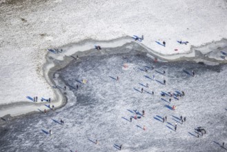 Aerial view, ice rink, ice skaters and pedestrians on frozen Rhine meadow in Lörrick near the