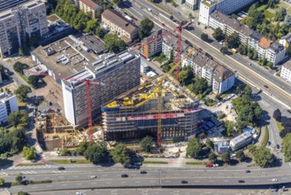 Aerial view, construction site and new construction of the three-storey Eclipse high-rise building
