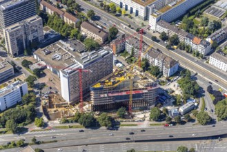 Aerial view, construction site and new construction of the three-storey Eclipse high-rise building