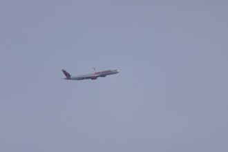 Aircraft of Air India airways in flight in a blue sky, London, England, United Kingdom