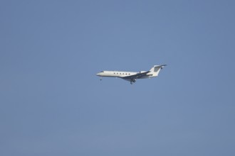 Executive business jet passenger aircraft in flight on approach to land, England, United Kingdom