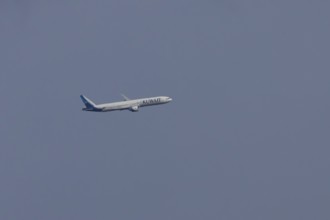 Boeing 777 jet passenger aircraft of Kuwait airlines in flight in a blue sky, England, United