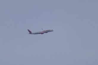 Airbus jet passenger aircraft of Air India airways in flight in a blue sky, London, England, United