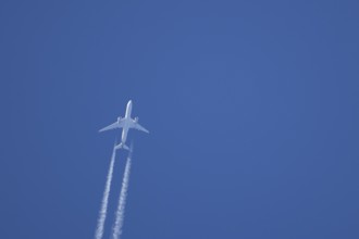 Airbus A350-900 passenger jet aircraft of Singapore airlines flying with a vapour trial or contrail
