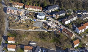 Aerial view, construction site and new construction of a multi-family housing estate in the