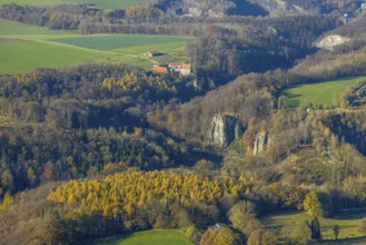Aerial view, Reckenhöhle dripstone cave in the autumnal forest in the district Volkringhausen in