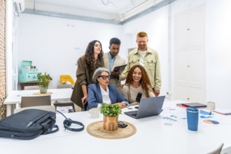 Diverse business team recording a podcast in a modern office, collaborating on content creation,