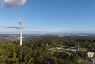 TV tower next to the Gazi stadium, with a view over extensive forests and soft clouds in the sky,