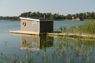 Sauna house by the water with a jetty, reeds, Åland, Åland Islands, Finland