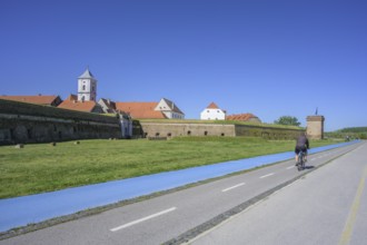 Fortress with church tower and cycle path and blue tread in the foreground, Tvrda, Osijek,