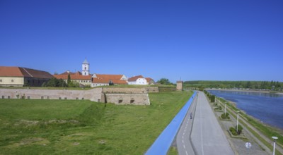 Fortress with church tower and cycle path and blue tread in the foreground, Tvrda, Osijek,