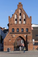 Historic city gate at the old harbour of Wismar Germany