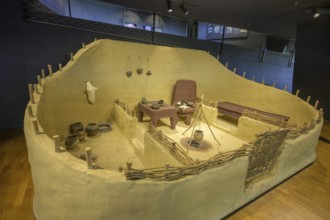 Reconstruction of a house with fireplace and furniture, Museum of Vucedol Culture, Vukovar,