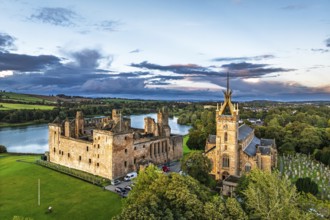 Sunset over Linlithgow Palace from a drone, Linlithgow Loch, West Lothian, Scotland, United Kingdom