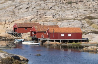 Falun red fishermen's huts by the sea, Bohus granite, rocky coast, Ramsvik, Ramsviklandet nature