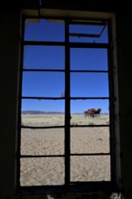 View from the window of the old German railway station of Garub into the Namib Desert, near Aus,