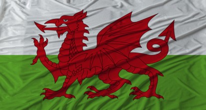 Welsh flag waving. Flag of Wales with cloth texture