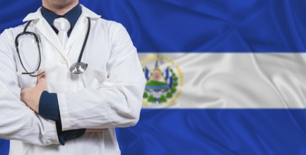 Male doctor with stethoscope on El Salvador flag. Doctor holding stethoscope on El Salvador flag
