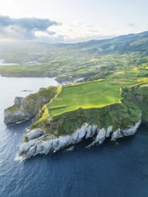 Cape Furado, Cliffs, Hills, Green Lush Fields, Pasturelands and Atlantic Ocean on Sunny Morning.
