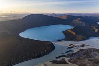 Turquoise crater lake Skyggnisvatn and glacial river, Icelandic Highlands, Iceland