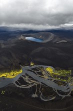 Blue crater lake in black sand desert, Icelandic Highlands, Iceland