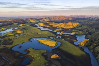 Mossy landscape and lakes at sunrise, Icelandic Highlands, Iceland