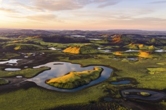 Mossy landscape and lakes at sunrise, Icelandic Highlands, Iceland