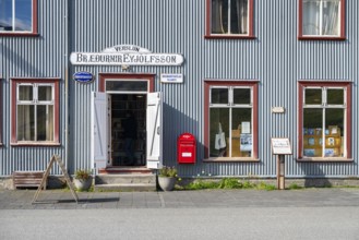 Shop window and entrance of the old bookshop in Flateyri, Westfjords, West Iceland, Iceland