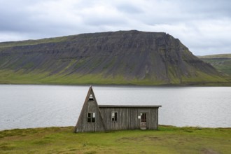 Old abandoned house by the fjord, Westfjords, West Iceland, Iceland