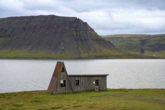 Old abandoned house by the fjord, Westfjords, West Iceland, Iceland