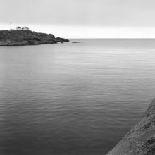 North Sea, Skagerrak, behind a rock with lonely white houses, black and white, analogue, Bohuslän,