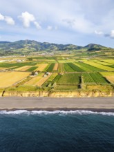 Santa Barbara Beach, Green Lush Fields with Pasturelands and Atlantic Ocean. Mountains on