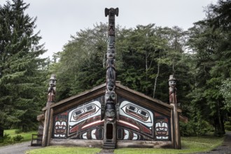 Totem poles at a Tlingit Clan House, Totem Bight State Historical Park, Ketchikan, Alaska, USA