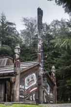 Totem poles at a Tlingit Clan House, Totem Bight State Historical Park, Ketchikan, Alaska, USA