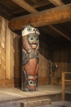 Totem poles in a Tlingit Clan House, Totem Bight State Historical Park, Ketchikan, Alaska, USA