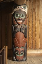 Totem poles in a Tlingit Clan House, Totem Bight State Historical Park, Ketchikan, Alaska, USA