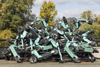 E-scooters stacked on top of each other are on display on the roof terrace of the Haus der Kulturen