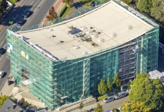Aerial view, Hamm Municipal Music School, covered building and construction site with new building,
