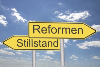 (Photomontage) Directional arrows labelled REFORMEN and STILLSTAND against a blue sky