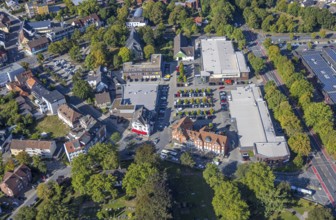 Aerial view, shopping centre Herringen with supermarket DM, Edeka Weber and Aldi, evang.